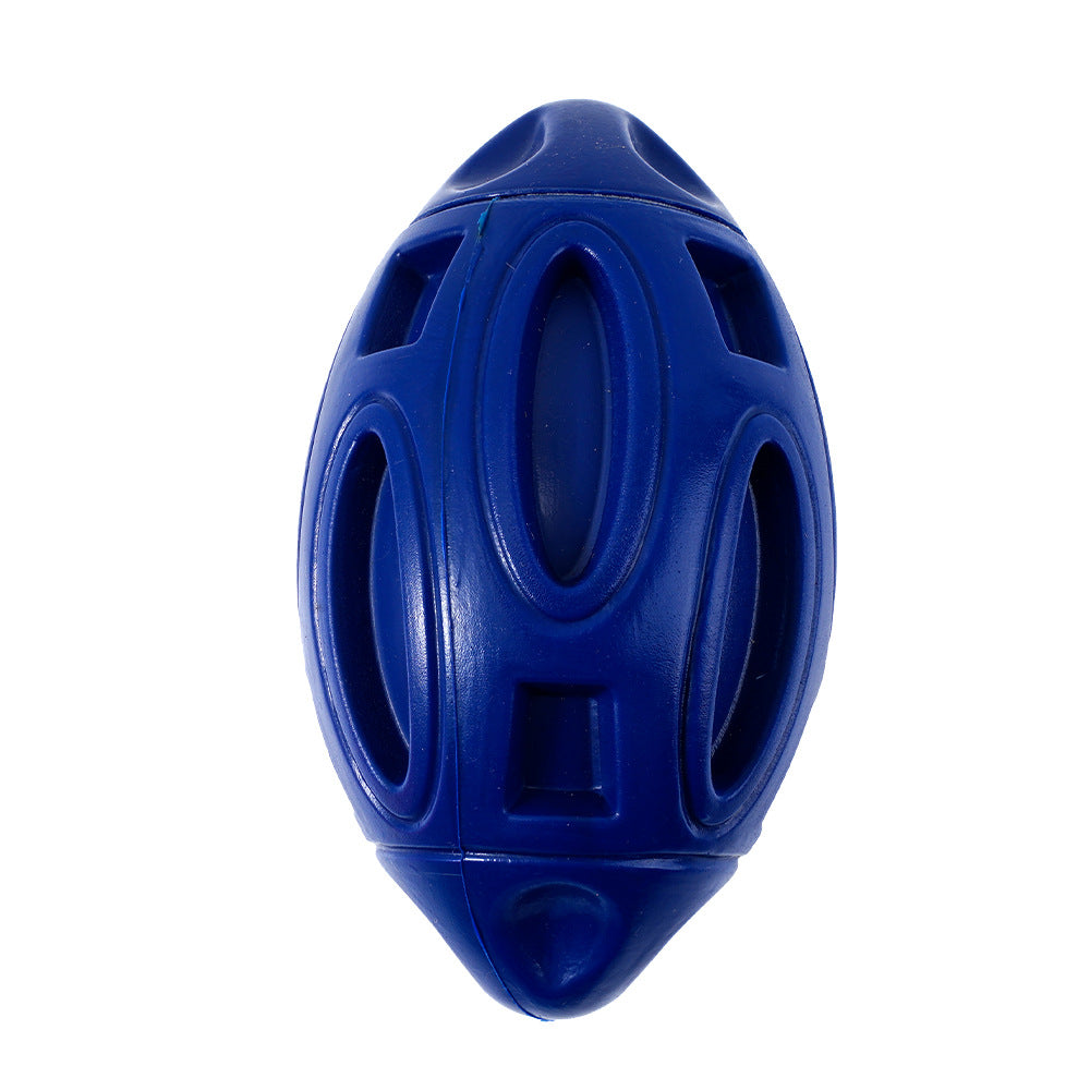 Close up of blue rubber rugby ball dog toy showing hollow cutout pattern