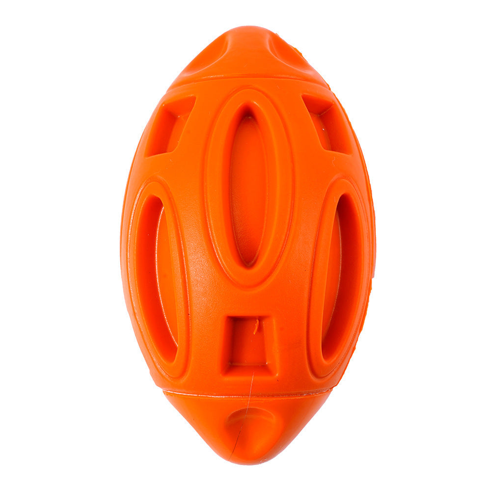 Orange football-shaped dog toy on a white background