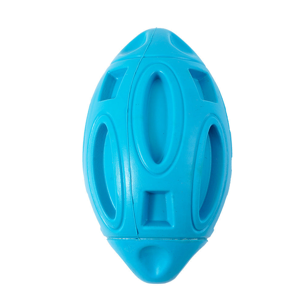 Close up of blue rubber rugby ball dog toy showing hollow cutout pattern