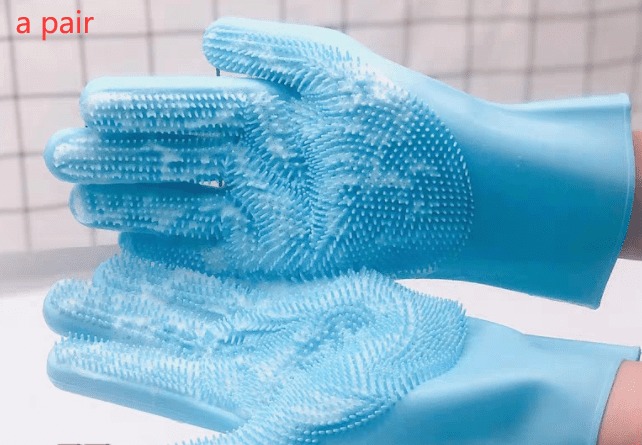 Pair of blue grooming gloves with textured surface on a white background