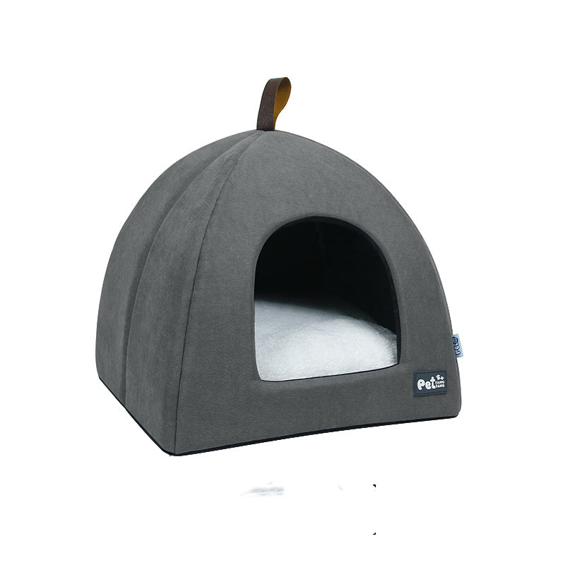 Gray pet bed with a white cushion on a white background