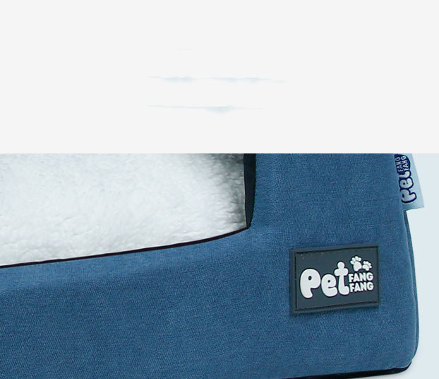Blue pet bed with a visible brand logo on a white background
