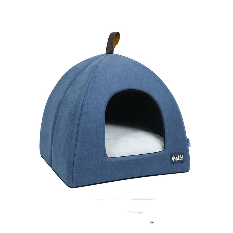Blue pet bed with a white cushion on a white background