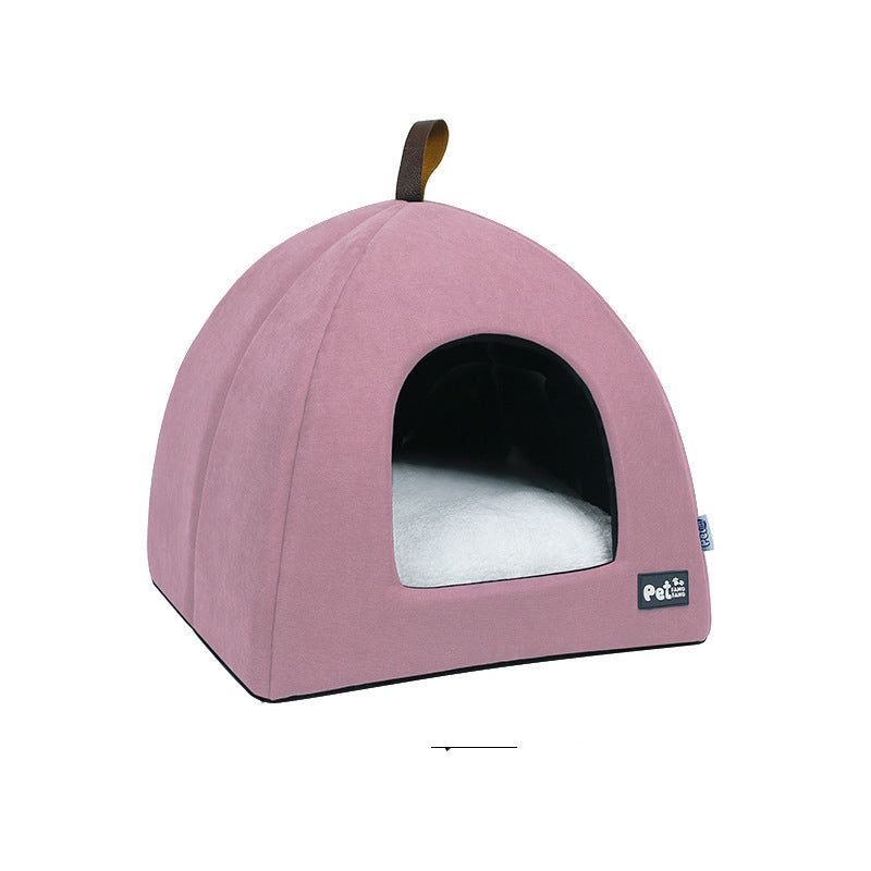 Pink pet bed with a white cushion on a white background