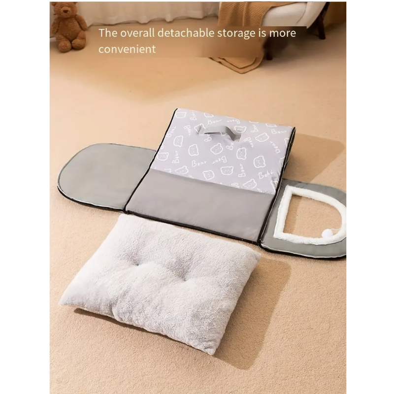 Gray detachable storage mat with a pillow on a beige floor.