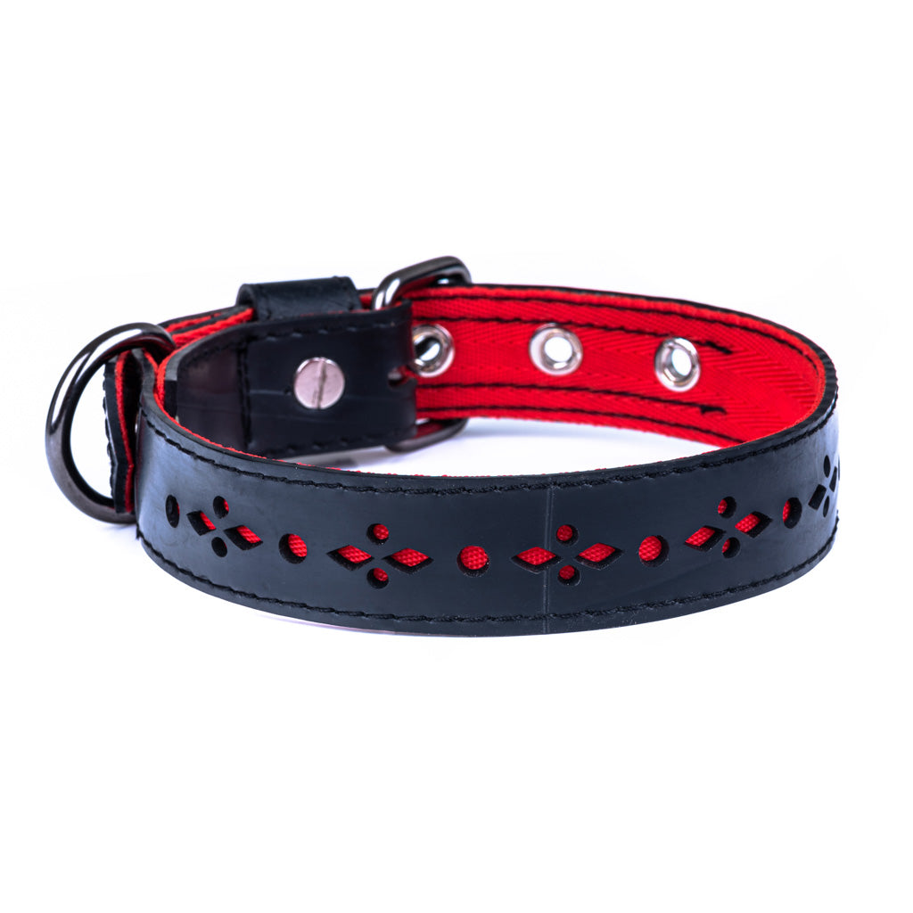 Black and red dog collar with decorative patterns on a white background